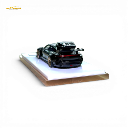 Black Porsche Taycan diecast model with roof box, 1:64 scale, detailed miniature car by Lot57Supplies Diecast Shop.