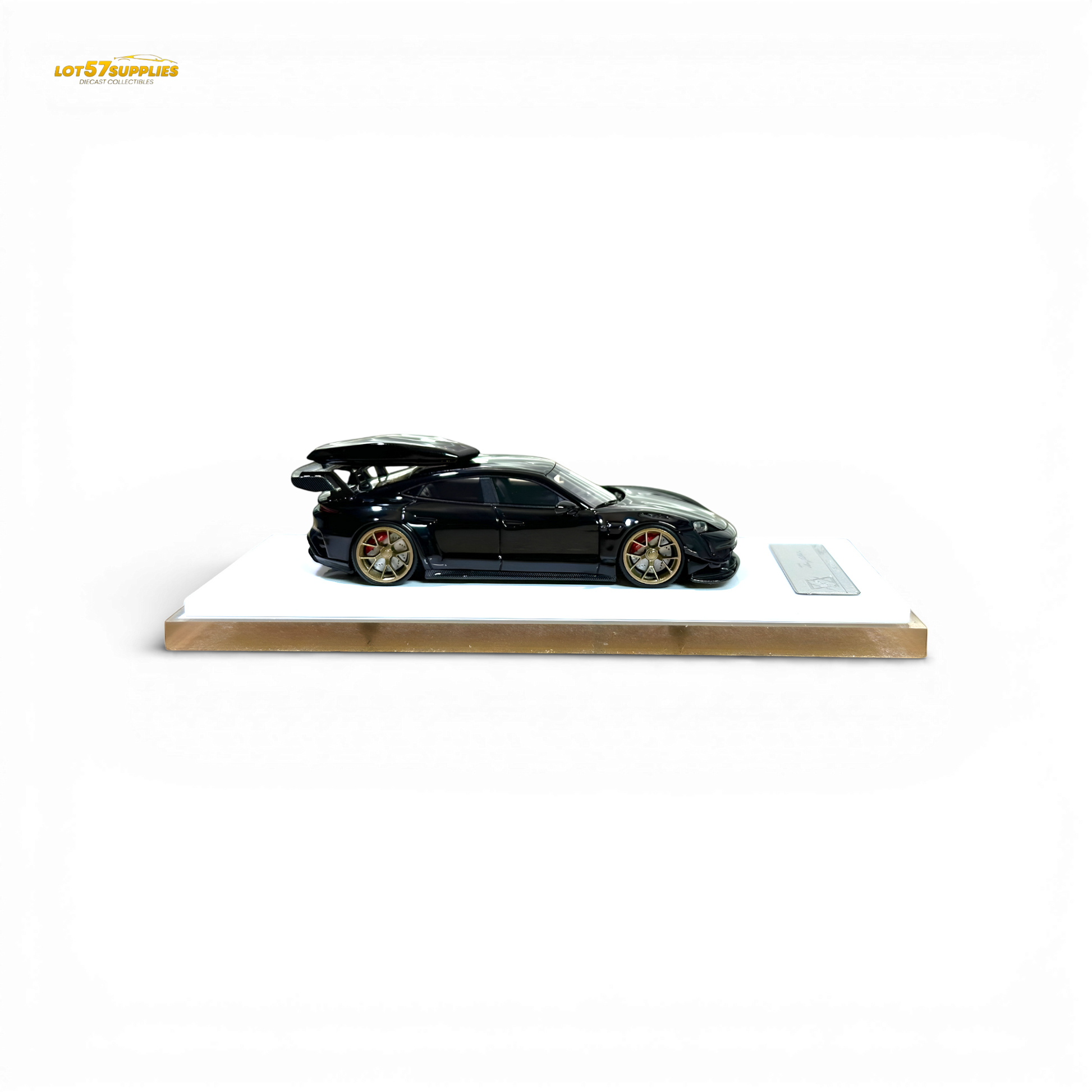 Diecast Porsche Taycan 1:64 scale model with roof box in black, detailed miniature car from Lot57Supplies Diecast Shop.