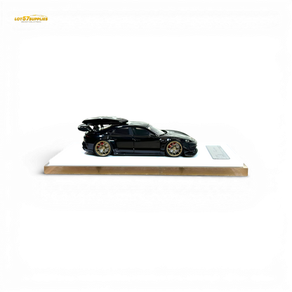 Diecast Porsche Taycan 1:64 scale model with roof box in black, detailed miniature car from Lot57Supplies Diecast Shop.