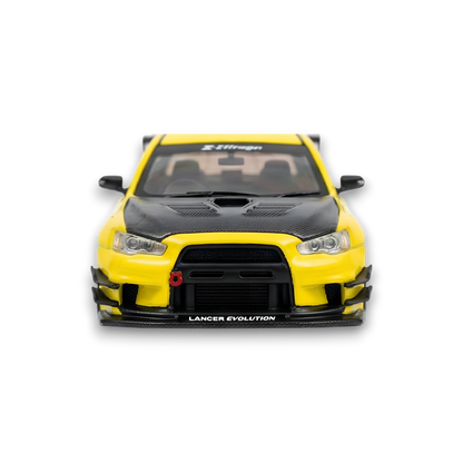 Yellow Mitsubishi Evolution X 1:64 scale diecast car with widebody kit and Varis styling, detailed model from Lot57Supplies.