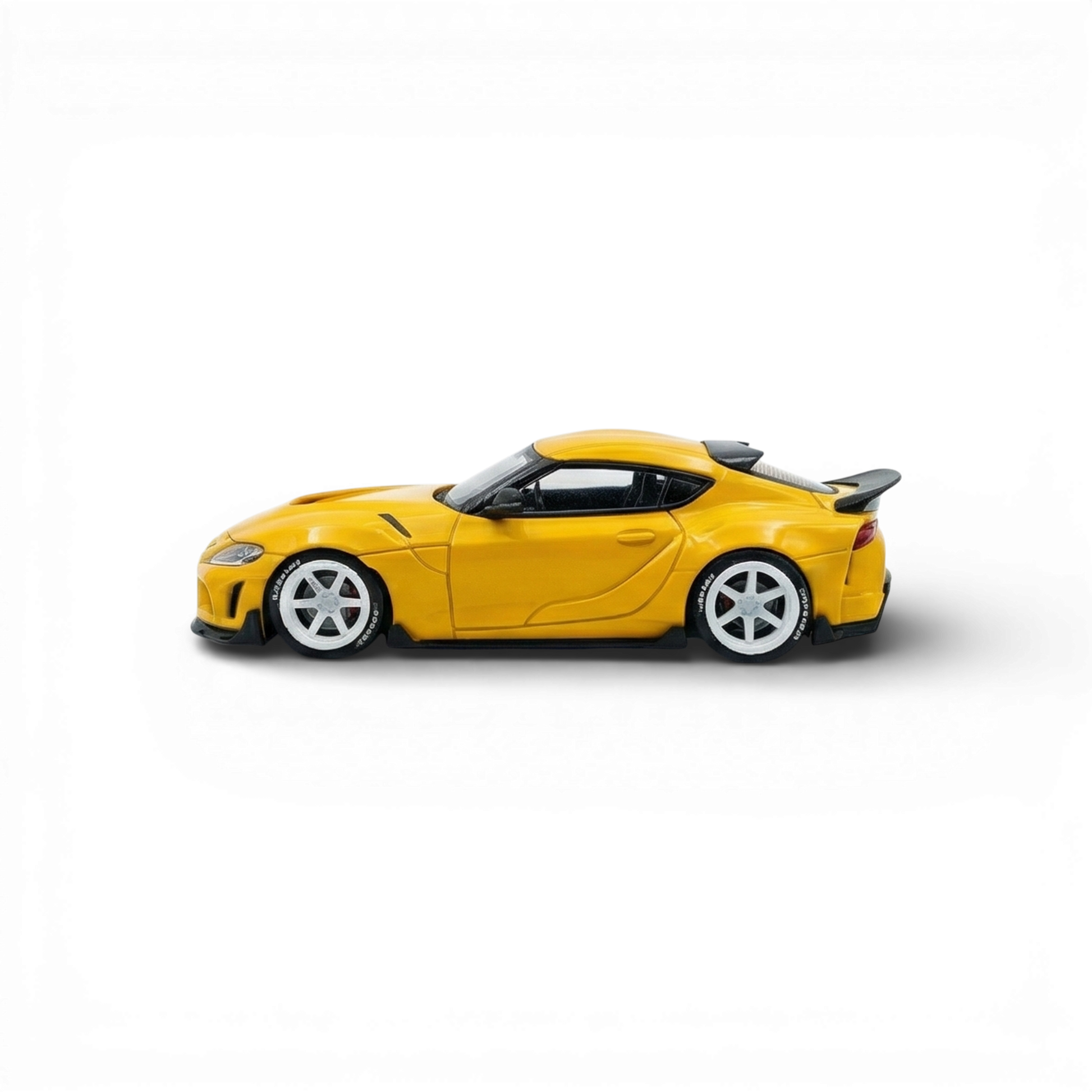 Yellow ATOZ Toyota Supra GR diecast model car in 1:64 scale, detailed miniature from Lot57Supplies Diecast Shop.
