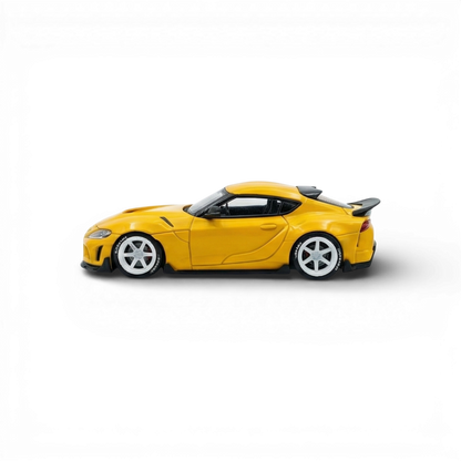Yellow ATOZ Toyota Supra GR diecast model car in 1:64 scale, detailed miniature from Lot57Supplies Diecast Shop.