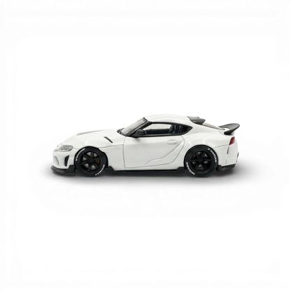 White 1:64 scale Toyota Supra GR diecast car by Lot57Supplies Diecast Shop, detailed model with realistic features.