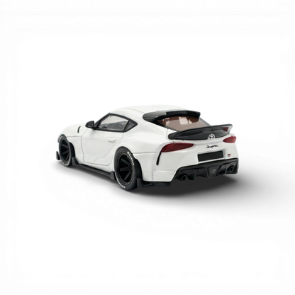 White 1:64 scale Toyota Supra GR diecast model by Lot57Supplies Diecast Shop, detailed miniature car with realistic features.