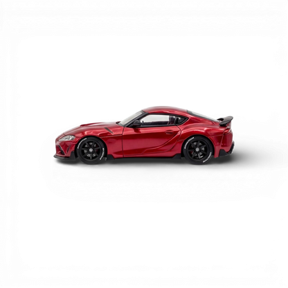 Red Toyota Supra GR diecast car model in 1:64 scale by Lot57Supplies Diecast Shop, showcasing metallic red finish and detailed design.