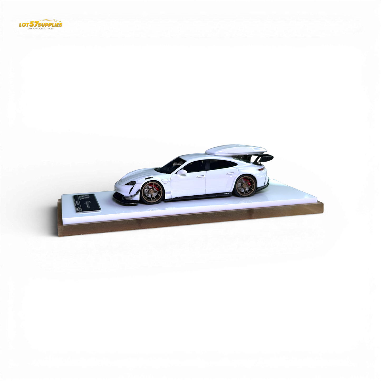 White Porsche Taycan diecast model with roof box in 1:64 scale, detailed miniature by Lot57Supplies Diecast Shop.