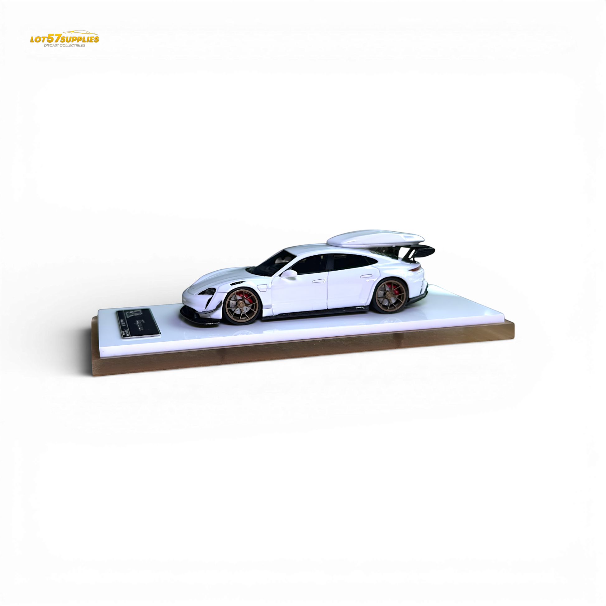 White Porsche Taycan diecast model with roof box in 1:64 scale, detailed miniature by Lot57Supplies Diecast Shop.