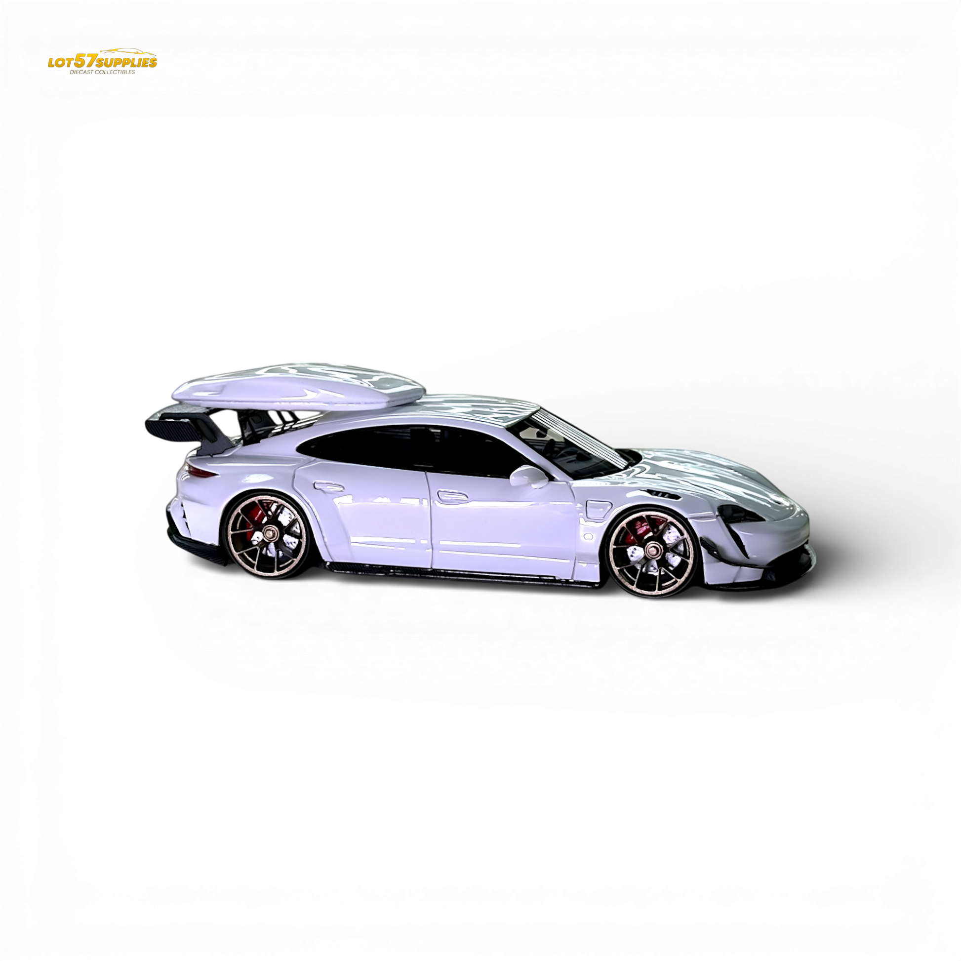 White Porsche Taycan diecast model with roof box, 1:64 scale, detailed miniature car from Lot57Supplies Diecast Shop.