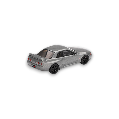 Mini GT Nissan Skyline GT-R NISMO BNR32 diecast model in dark metal gray, 1:64 scale, detailed Nissan car replica.