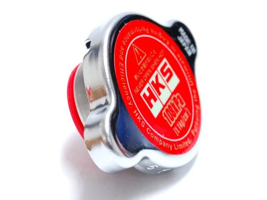 FR SPORT HKS D1 Limited Edition radiator cap, 1.1 kg/cm^2, showcasing the metal cap with HKS branding and pressure specifications.