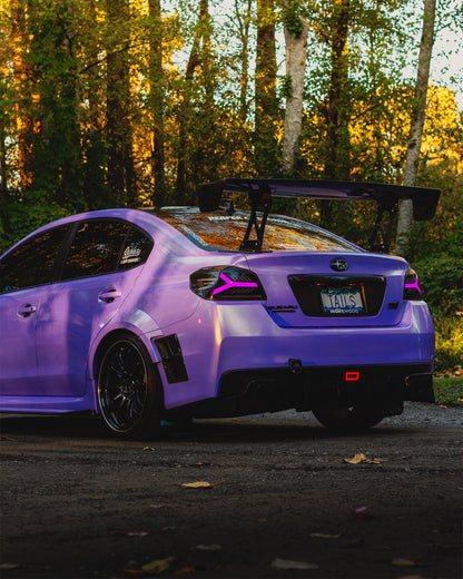 OLM Y-Spec LED taillights with smoke lens and RGB optic for 2015-2021 Subaru WRX/STI, showcasing sleek tail light design.