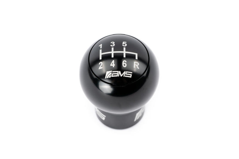 FR SPORT AMS Performance Subaru WRX/STi 6-speed billet shift knob with red, black, and gunmetal caps on a manual transmission.