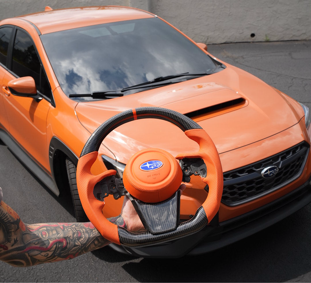 JDMuscle Ultimate Series steering wheel for 2022-2025 Subaru WRX, compatible with manual and CVT transmissions, close-up view.