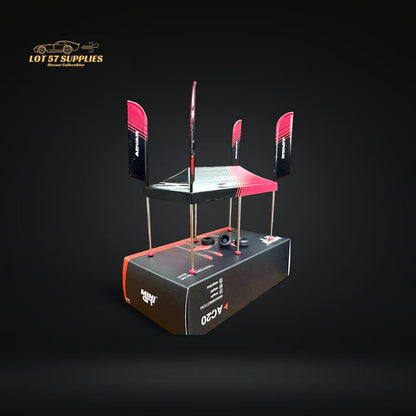 Mini-GT Paddock Service Tent accessory by Lot57Supplies for 1:64 scale Advan diecast racing cars, shown on display.