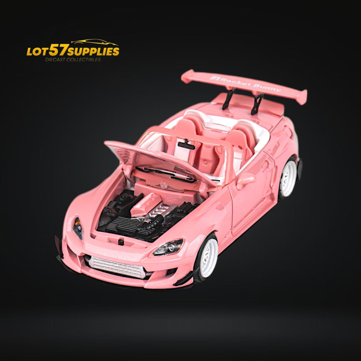 Pink Honda S2000 Microturbo diecast model with Rocket Bunny body kit, 1:64 scale, detailed and vibrant for collectors.