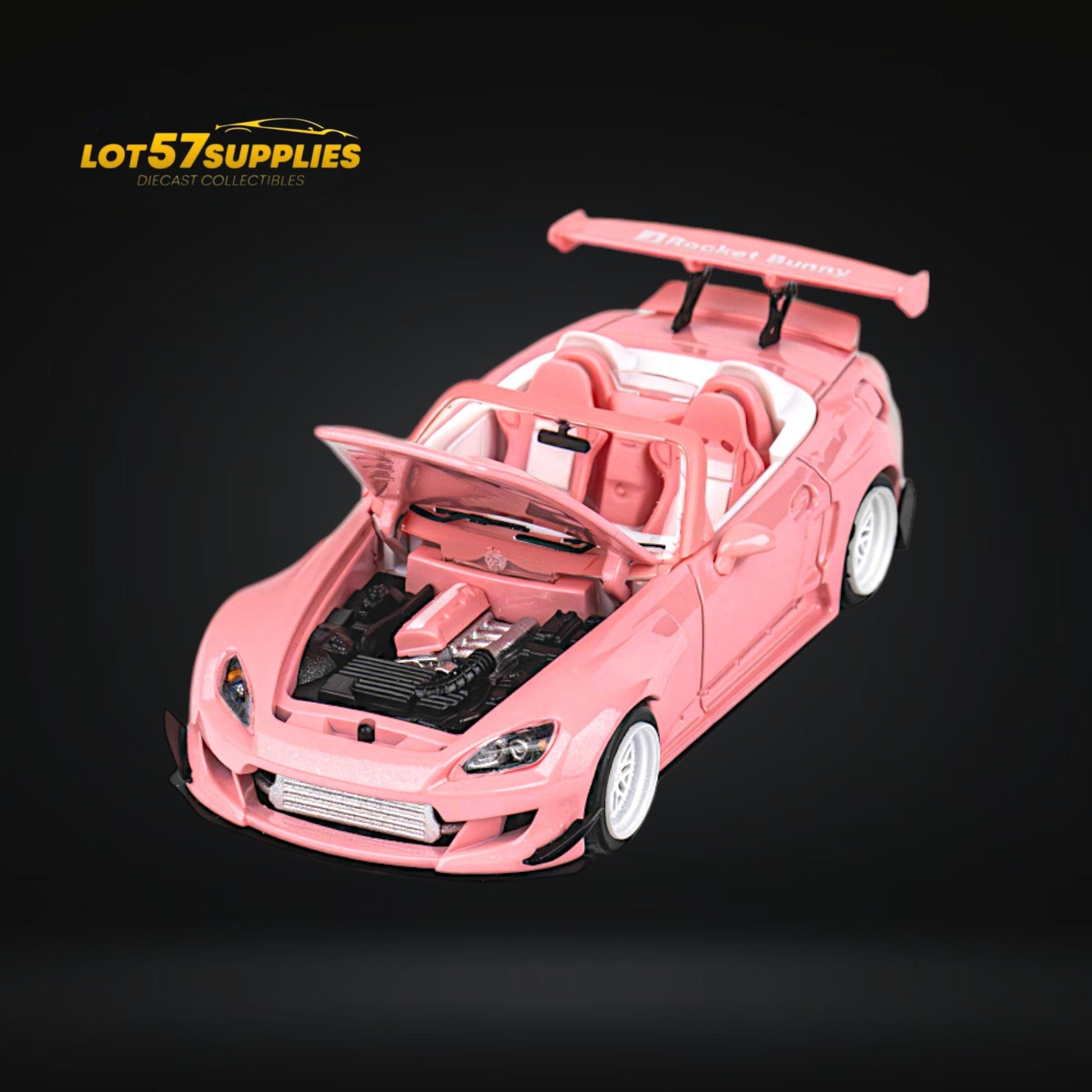 Pink Honda S2000 Microturbo diecast model with Rocket Bunny body kit, 1:64 scale, detailed and vibrant for collectors.