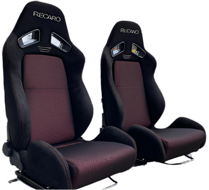 Speedzone Performance LLC Race Master racing seats, black with red accents, featuring adjustable headrests and sturdy side bolsters.