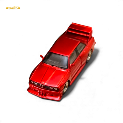 Red SW BMW E30 M3 LTO diecast model car in 1:64 scale with detailed features and sporty design.