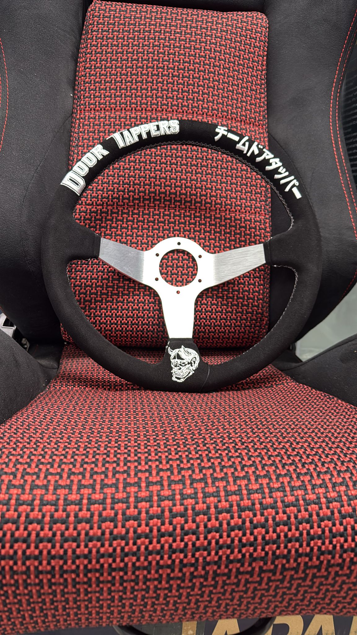 SPD Z1 X DoorTapper steering wheel by Speedzone Performance LLC, featuring a sleek black design and ergonomic grip.