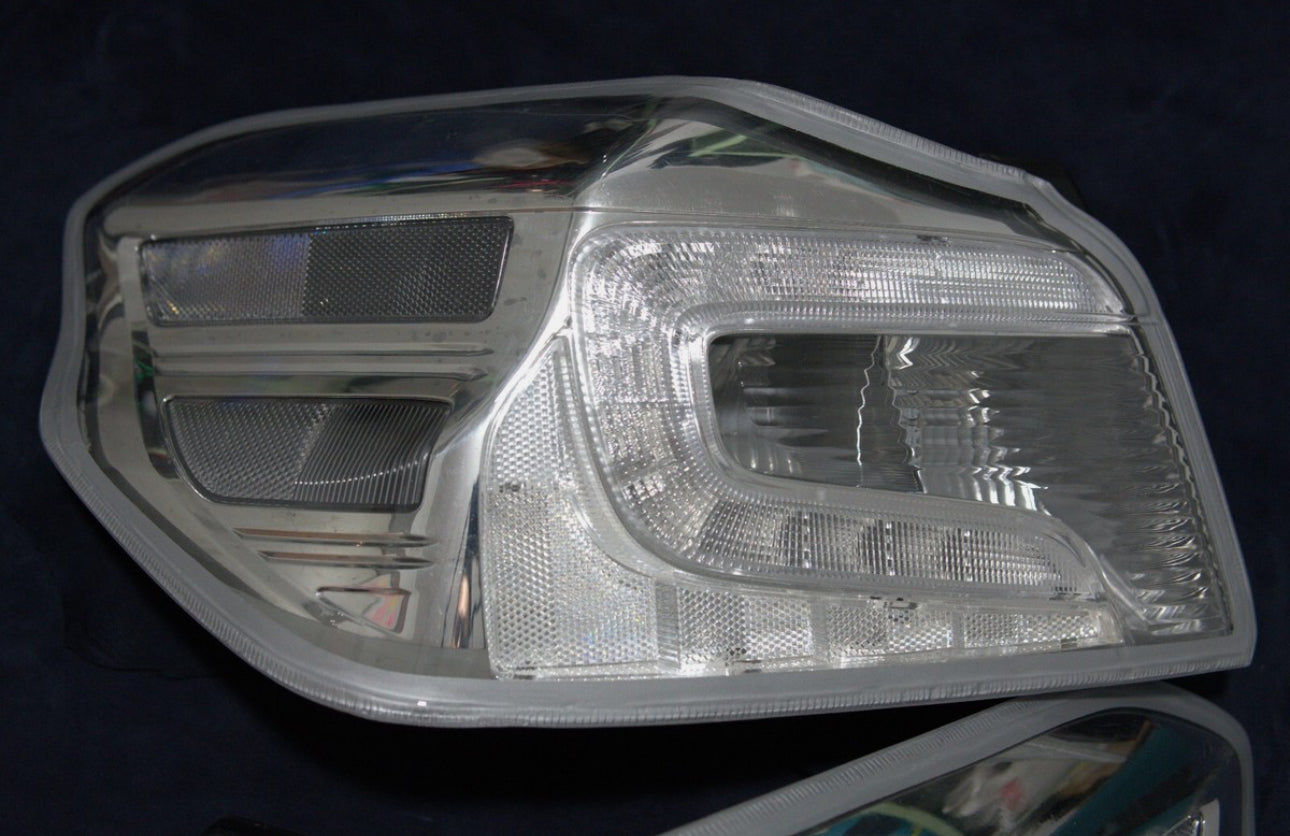 NTXGlow clear tail light lenses for 2015-2021 Subaru WRX/STI, lens-only set with reflective surfaces and mounting points visible