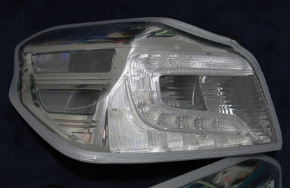 NTXGlow clear tail light lenses for 2015-2021 Subaru WRX/STI, lens-only set with reflective surfaces and mounting points visible