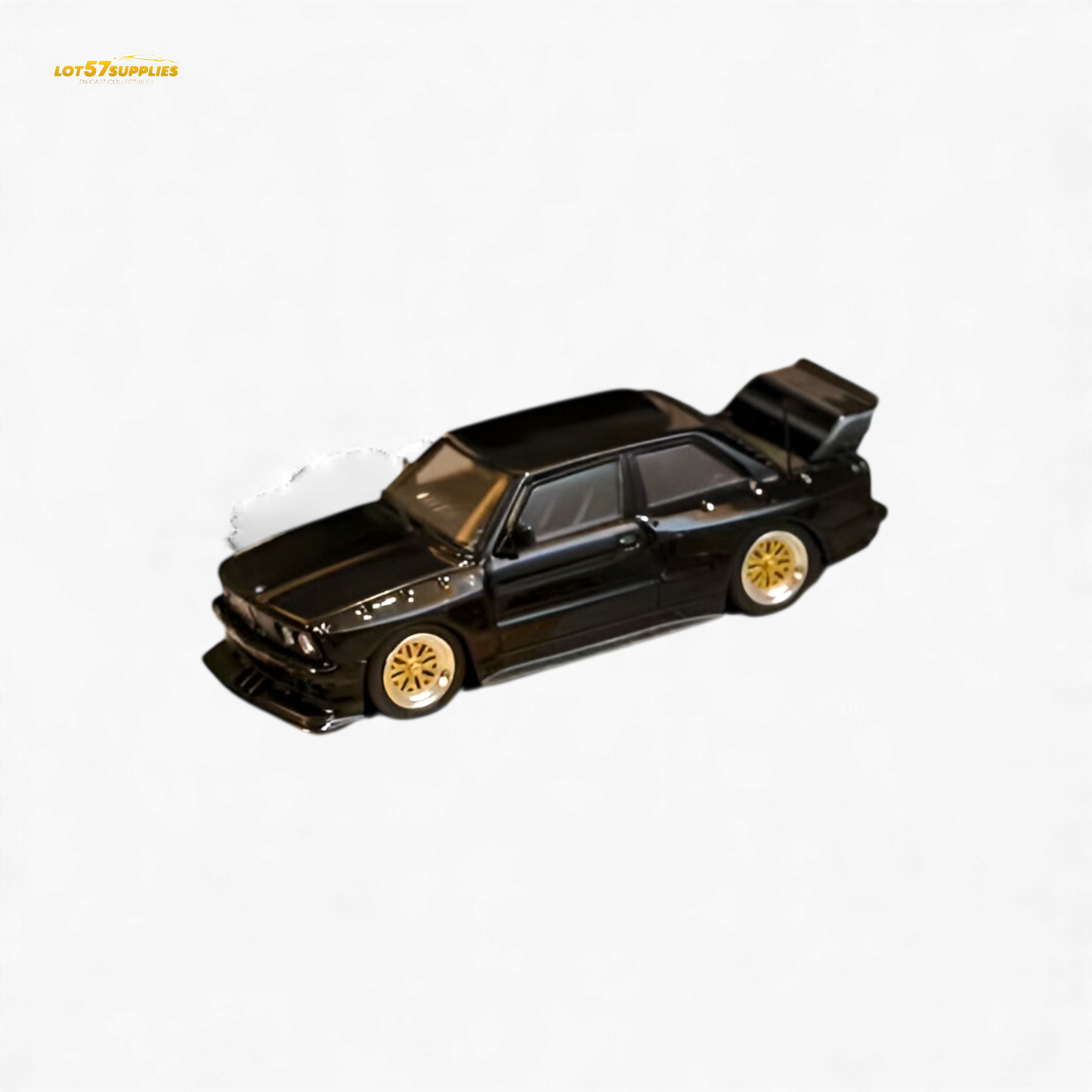 Black SW BMW E30 M3 LTO diecast model car in 1:64 scale, showcasing detailed exterior features and sporty design.