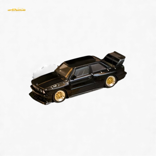 Black SW BMW E30 M3 LTO diecast model car in 1:64 scale, showcasing detailed exterior features and sporty design.
