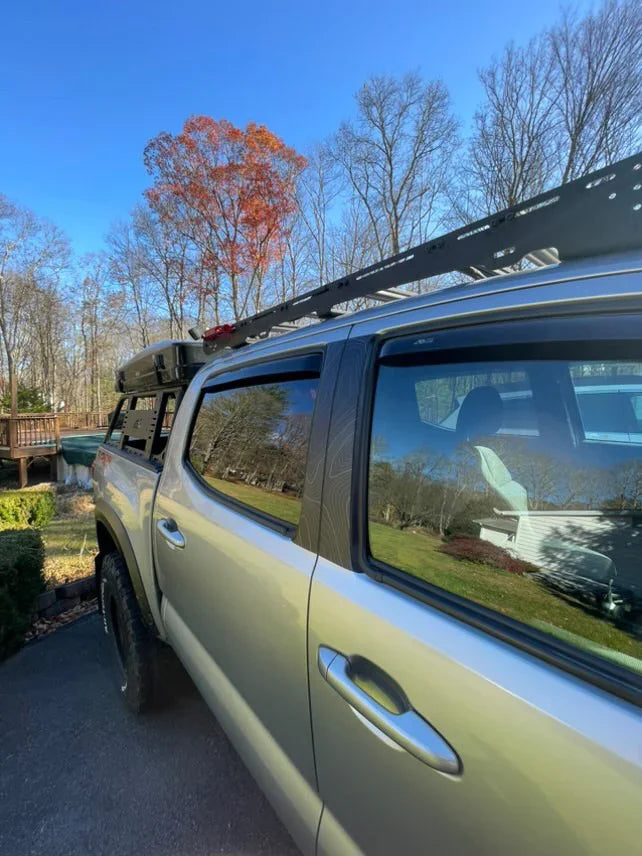 Exterior vinyl Topo B Pillar overlays for 2016-2023 Tacoma Double Cab, featuring a geometric black and white design.