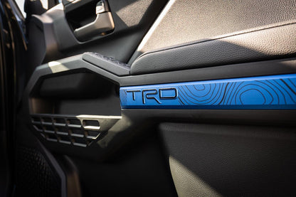 Vinyl interior door line overlays for 2024+ Toyota Tacoma by StickerFab, showing sleek black trim on vehicle doors.