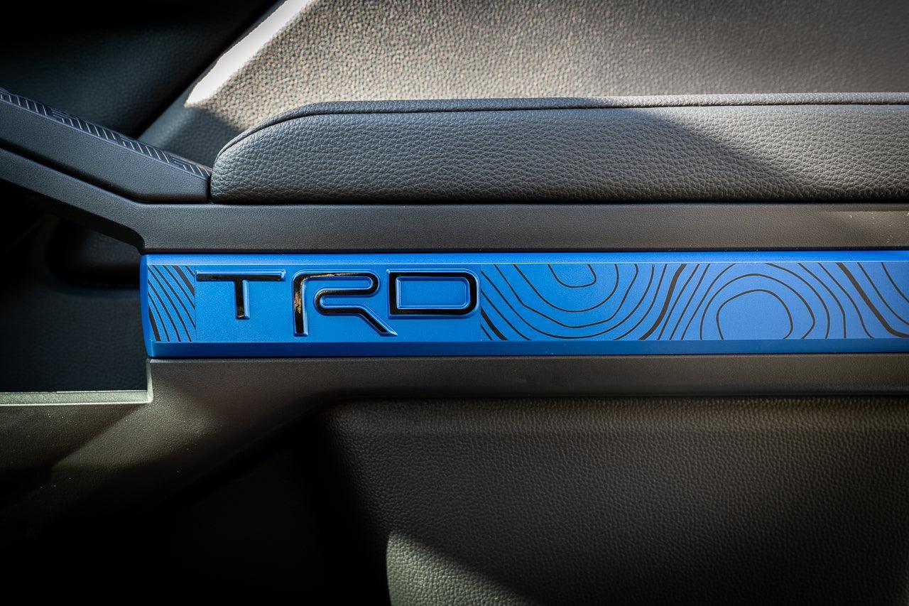 Vinyl interior door line overlays for 2024+ Toyota Tacoma by StickerFab, showcasing sleek TRD-style design on car doors.