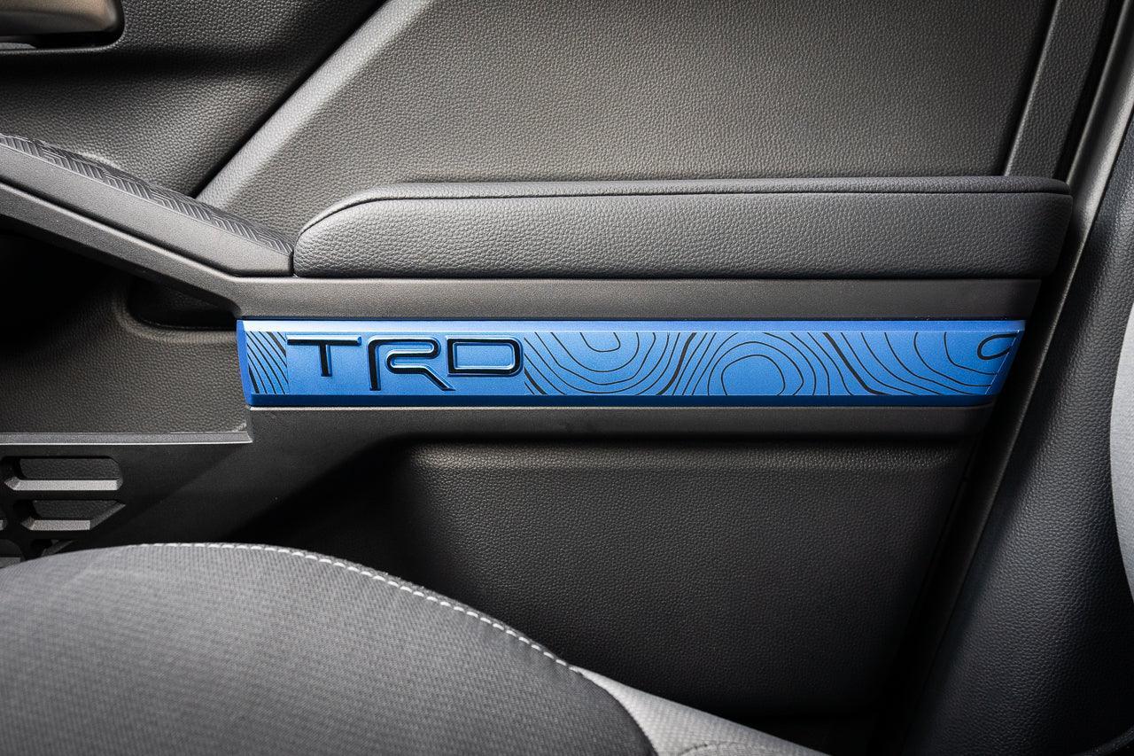 Vinyl interior door line overlays for 2024+ Toyota Tacoma by StickerFab, featuring stylish TRD-themed design.
