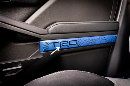 Vinyl TRD door line overlays for 2024+ Toyota Tacoma interior, shown on vehicle door panels with a sleek finish.