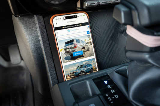 StickerFab 25W MagSafe wireless charger pad attached to factory cubby in a 2024+ Toyota Tacoma and 2025+ 4Runner dashboard.