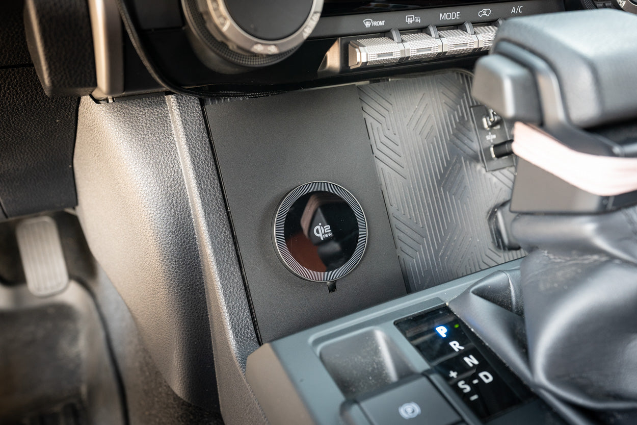 StickerFab 25W Magsafe wireless charger pad for factory cubby in 2024+ Tacoma and 2025+ 4Runner vehicle interior.