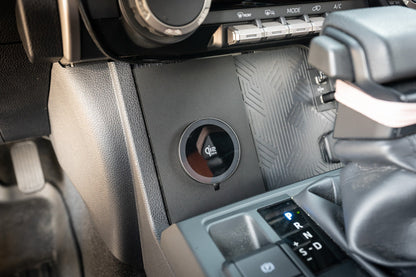 StickerFab 25W Magsafe wireless charger pad for factory cubby in 2024+ Tacoma and 2025+ 4Runner vehicle interior.