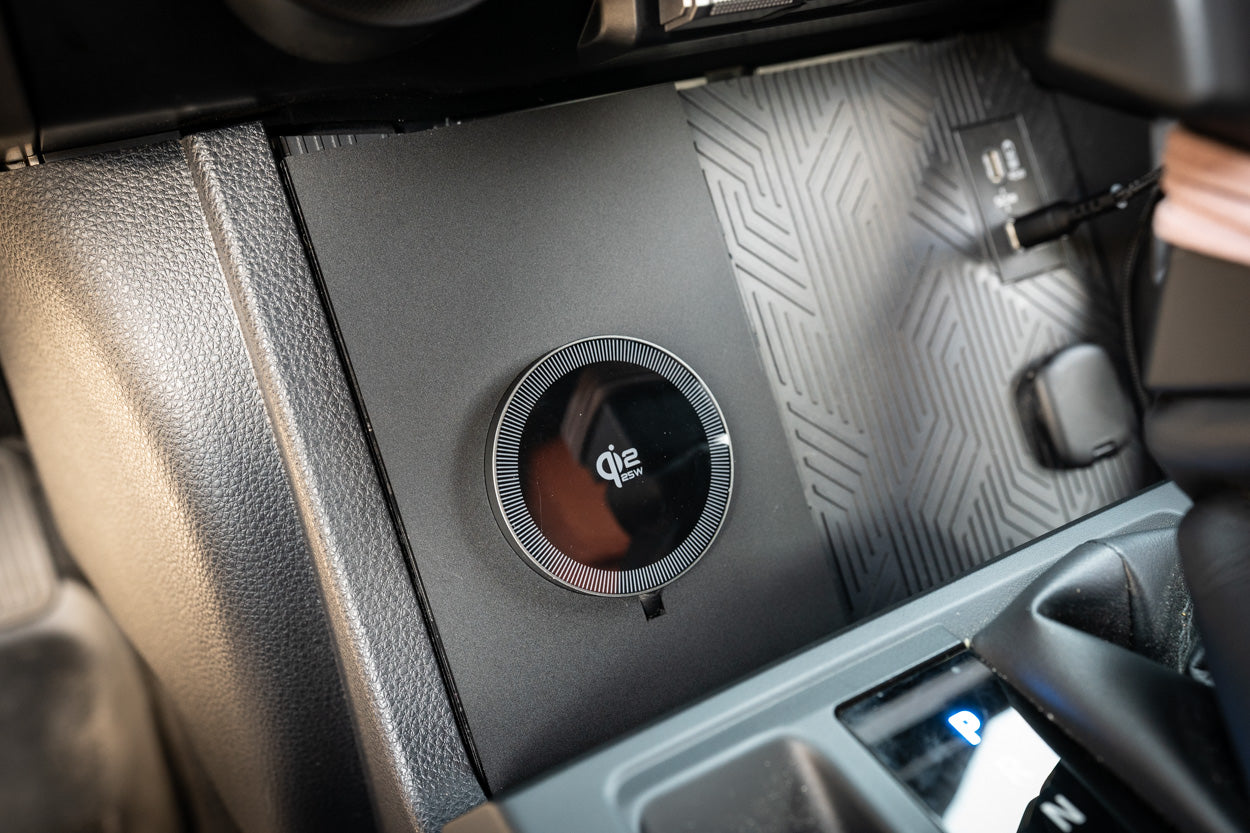 StickerFab 25W Magsafe wireless charger pad mounted in factory cubby for 2024+ Tacoma and 2025+ 4Runner phone mounts.