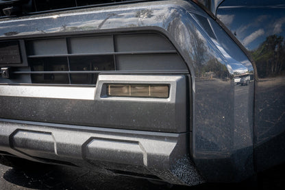 Vinyl fog light overlays for 2024+ Toyota Tacoma, exterior accessory by StickerFab, shown installed on vehicle with close-up view
