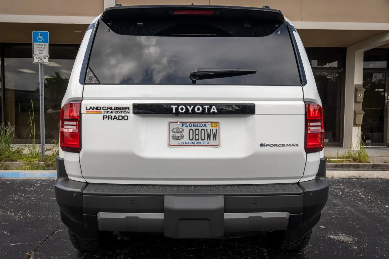 Toyota Land Cruiser rear tailgate emblem overlays, StickerFab branding, shiny chrome finish, designed for 2024+ models.