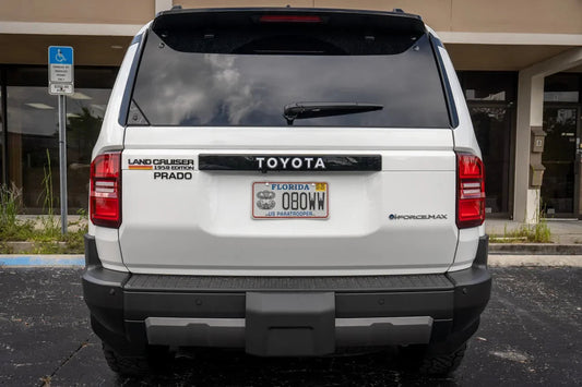 Toyota Land Cruiser rear tailgate emblem overlays, StickerFab branding, shiny chrome finish, designed for 2024+ models.