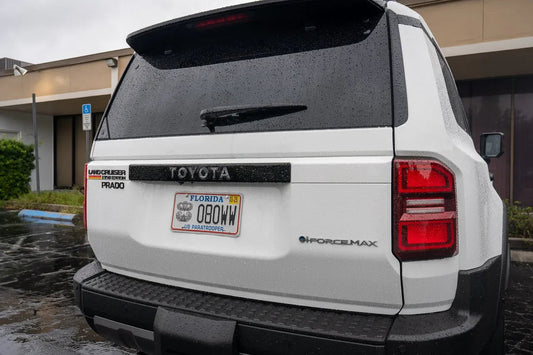 Toyota Land Cruiser 2024+ rear tailgate emblem overlays by StickerFab, featuring stylish, high-quality emblem design for vehicle customization.