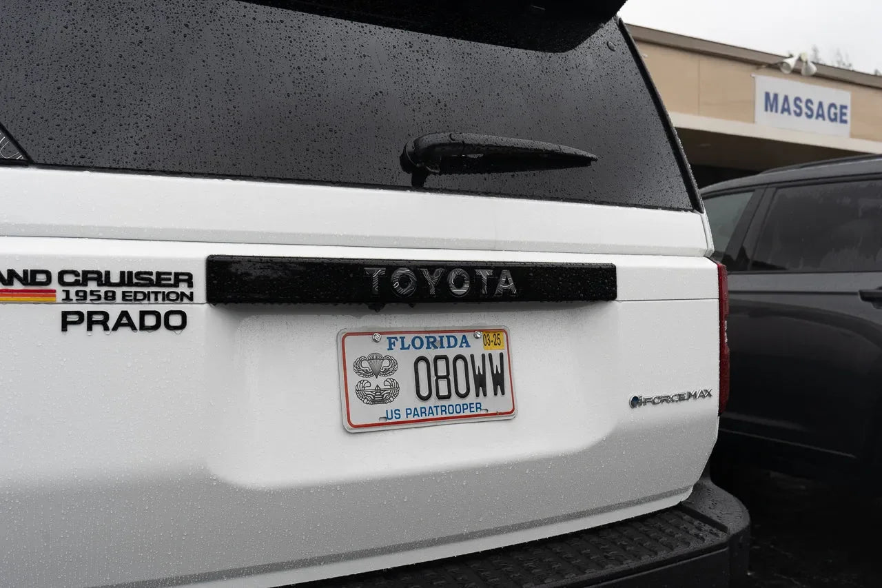 Toyota Land Cruiser 2024+ Topo Rear Tailgate Emblem Overlay by StickerFab, showing a sleek metallic emblem on the tailgate.