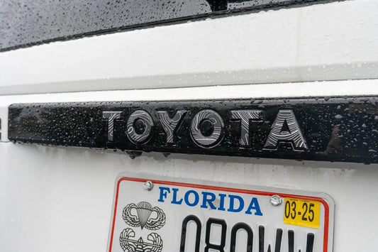 Toyota Land Cruiser 2024+ Topo rear tailgate emblem overlays by StickerFab, showcasing sleek design on vehicle tailgate.