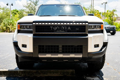 Toyota Land Cruiser and FJ Cruiser front grille emblem kit by StickerFab, featuring stylish emblems for 2007-2014 FJ Cruiser and 2024+ Land Cruiser.