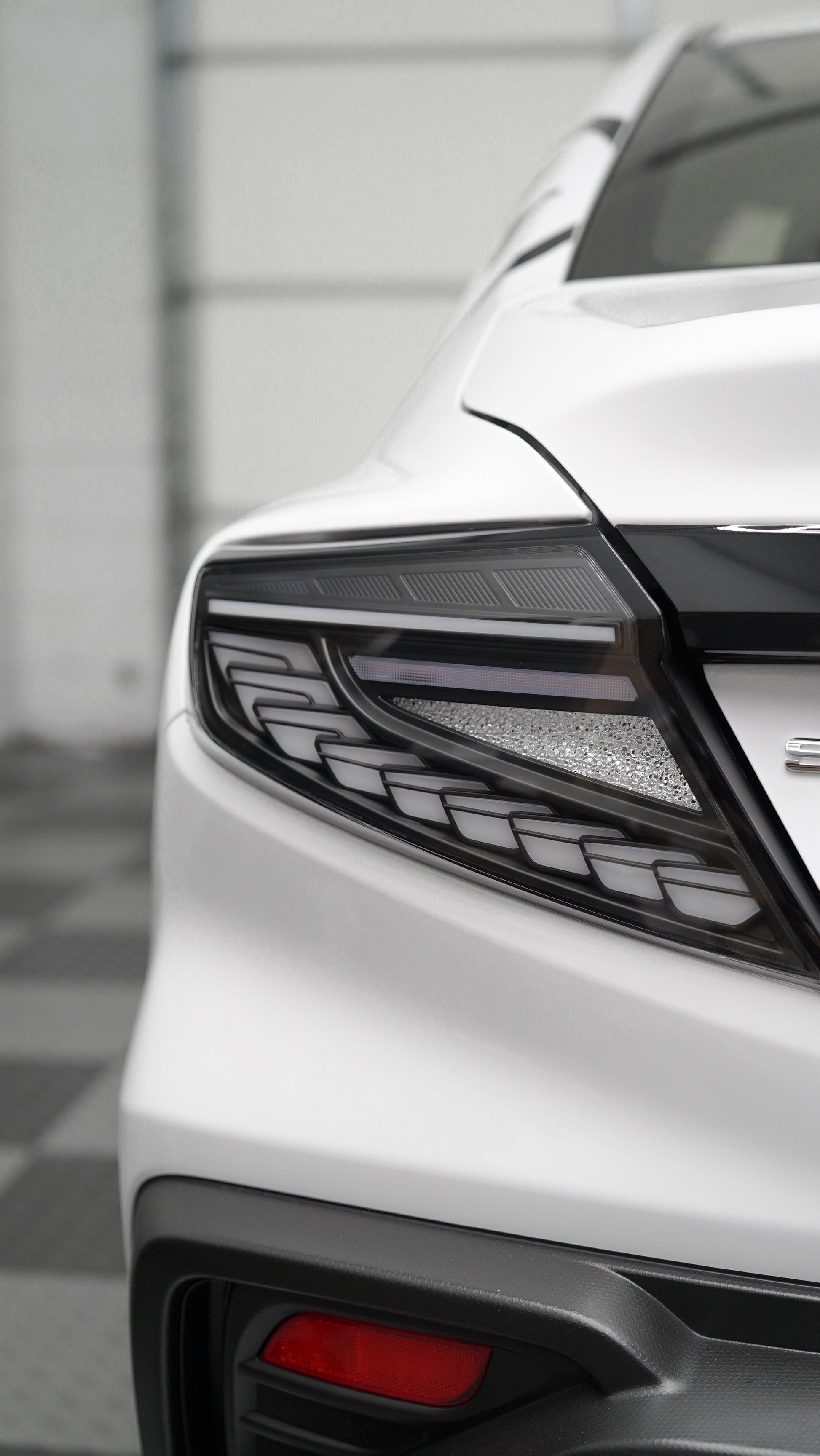 JDMuscle Version Doragon LED tail lights installed on a 2022-2025 Subaru WRX, showcasing bright red and clear lens details.
