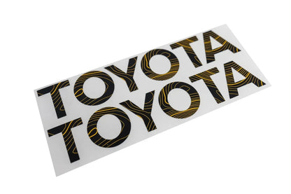 Toyota Land Cruiser 2024+ Topo rear tailgate emblem overlays by StickerFab, close-up view of sleek vehicle badge customization.