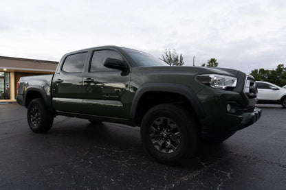 Smoked vinyl sidemarker overlays for front of 2016-2023 Toyota Tacoma, exterior automotive accessory by StickerFab.