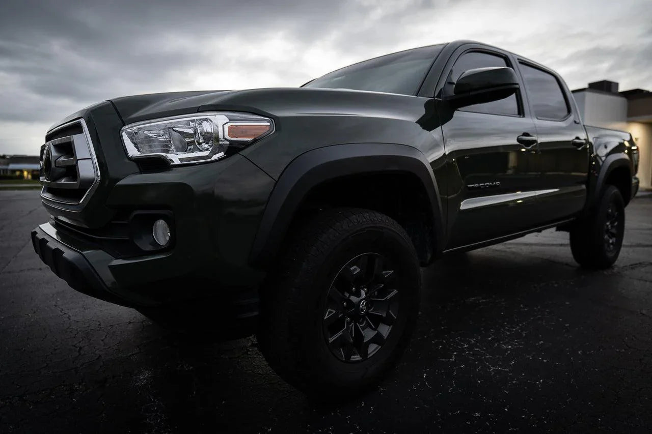 Front smoked sidemarker overlays for 2016-2023 Toyota Tacoma, vinyl exterior accessories with StickerFab branding.