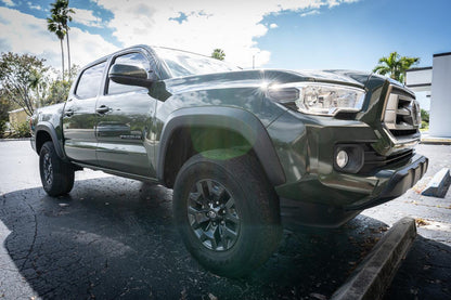 Smoked vinyl sidemarker overlays for 2016-2023 Toyota Tacoma front exterior, designed by StickerFab.
