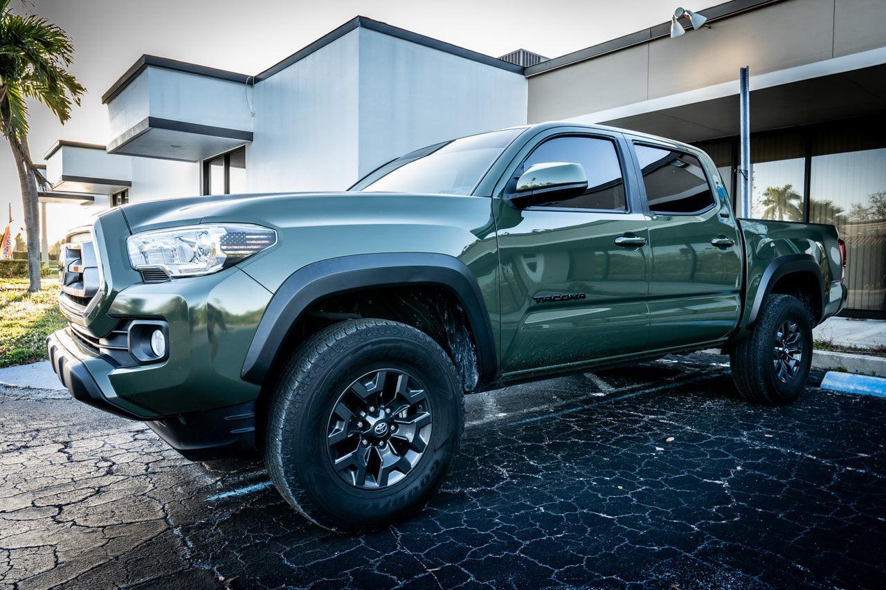 Exterior vinyl Topo B Pillar Overlays for 2016-2023 Tacoma Double Cab by StickerFab, showing the textured black overlays on vehicle pillars.