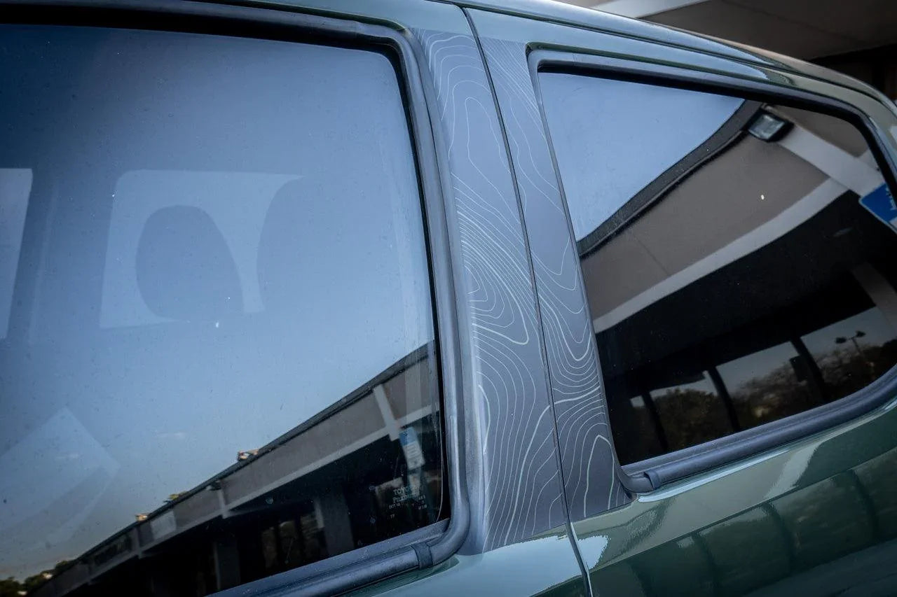 Vinyl exterior Topo B Pillar overlays for 2016-2023 Toyota Tacoma double cab by StickerFab, shown on vehicle side.